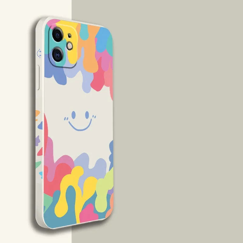 White TPU iPhone case with rainbow smiley faces on top and bottom, includes a black lanyard.