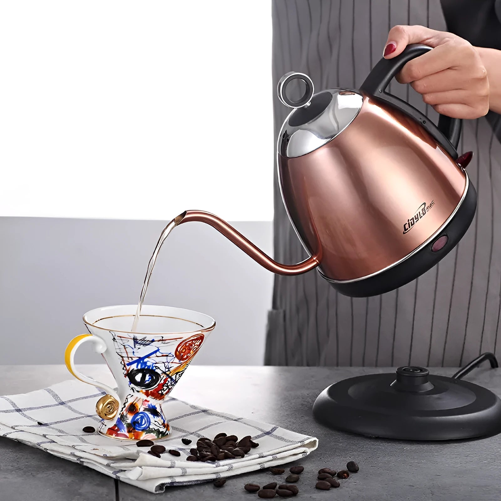 Stainless steel constant temperature kettle in gold colour with touch controls and 1 litre capacity