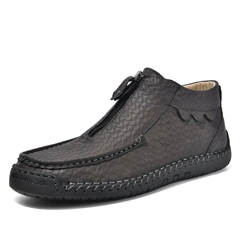 Men's solid colour slip-on loafers with round toe and rubber sole, shown in black, brown, and grey.