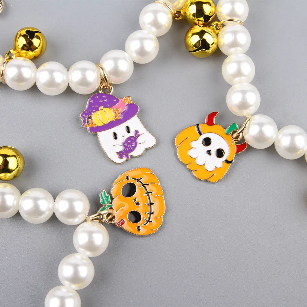 Halloween-themed cat collar with simulated pearl necklace decoration showing pumpkin designs