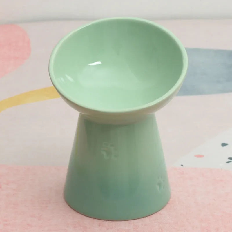 High-foot ceramic pet bowl with chin protector and anti-tumble base design