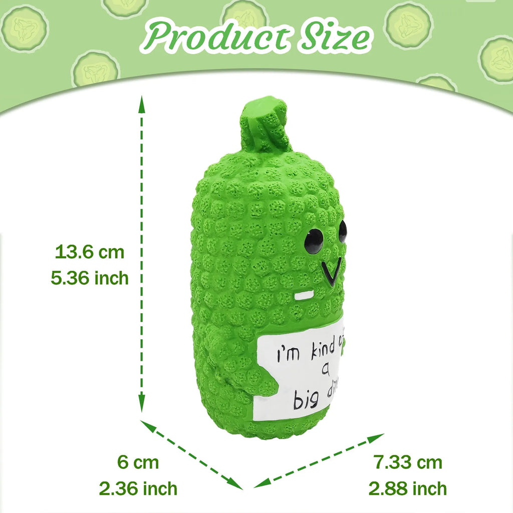 Green pickle-shaped squeaky latex dog chew toy with textured nubs on a white background.