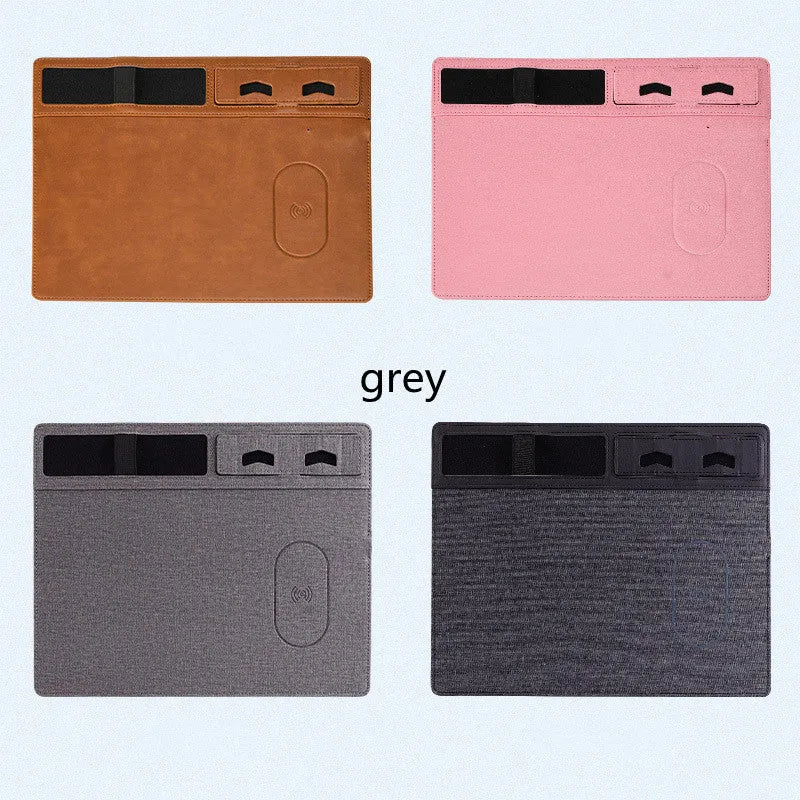 Pink wireless charging mouse pad with phone holder on a desk, dimensions 320mm by 260mm.