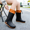 Women's PVC rain boots in non-slip wear-resistant design showing four colour options
