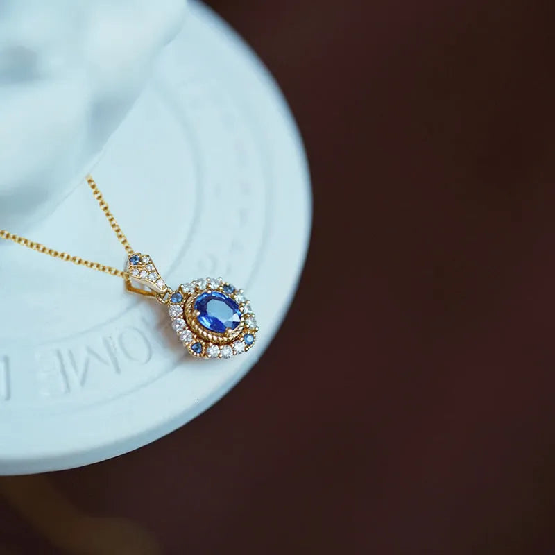 Adjustable women's necklace with mixed gemstone pendant on gold-colour box chain