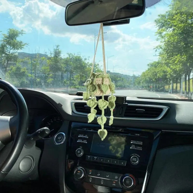 Knitted green and white car plant decoration with hanging rope