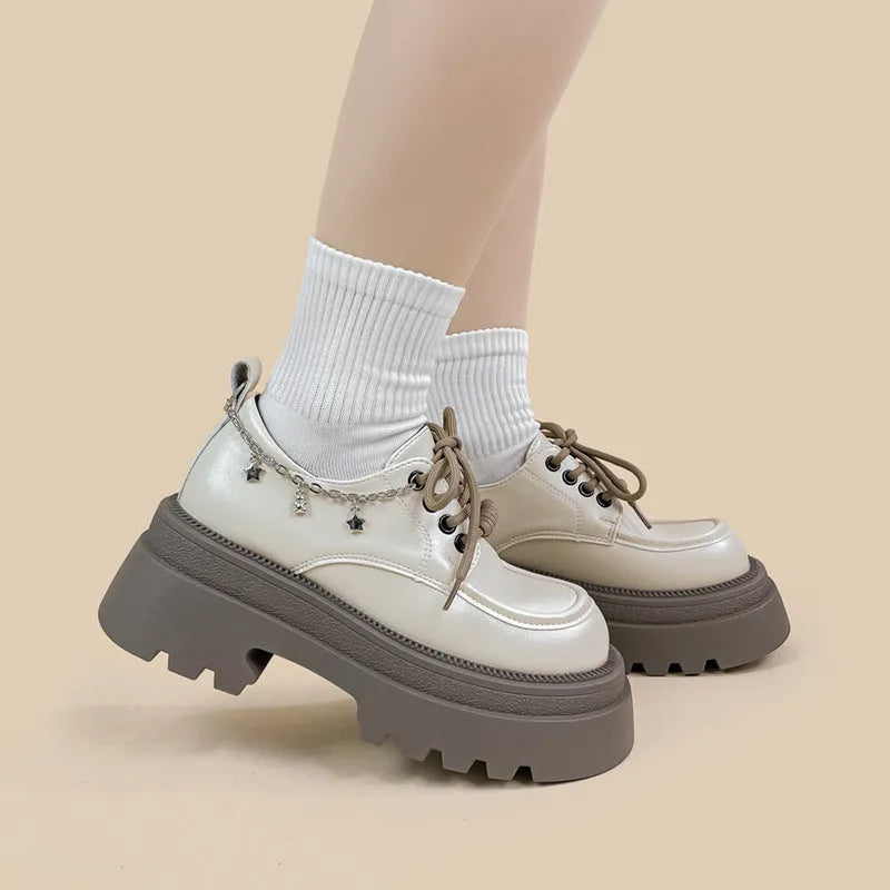 White platform leather Mary Jane shoes with round toe, lace-up front, and a thick 6-8cm chunky heel.