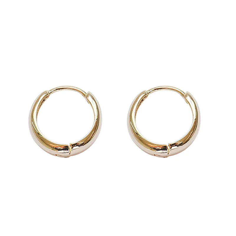 Women's retro minimalist geometric water drop earrings in gold or silver on a copper base.
