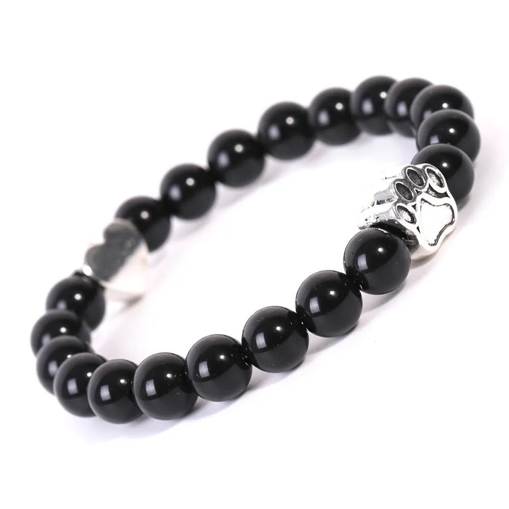 Tigereye Indian agate bracelet with geometric heart charm and dog's paw motifs on wrist