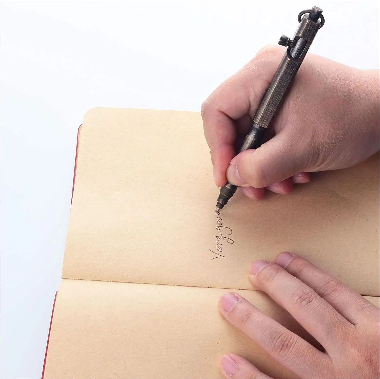 Solid brass tactical pen with hexagonal bolt design on barrel.