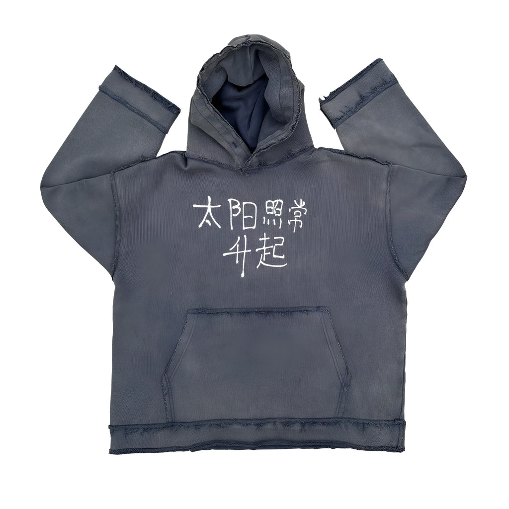 Dark blue hooded sweatshirt with a graphic design on the back, shown in a casual setting.