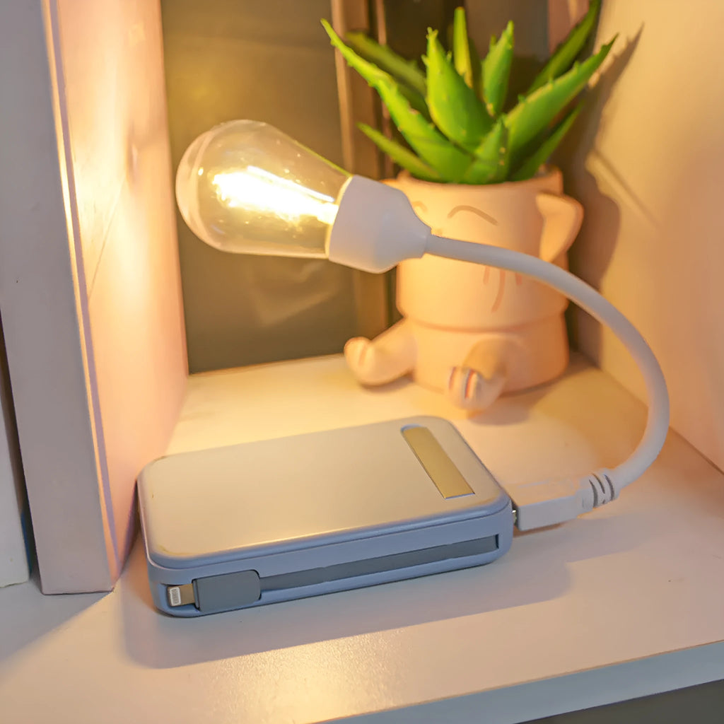 Folding USB rechargeable night light with warm white tungsten bulb, shown in open position.