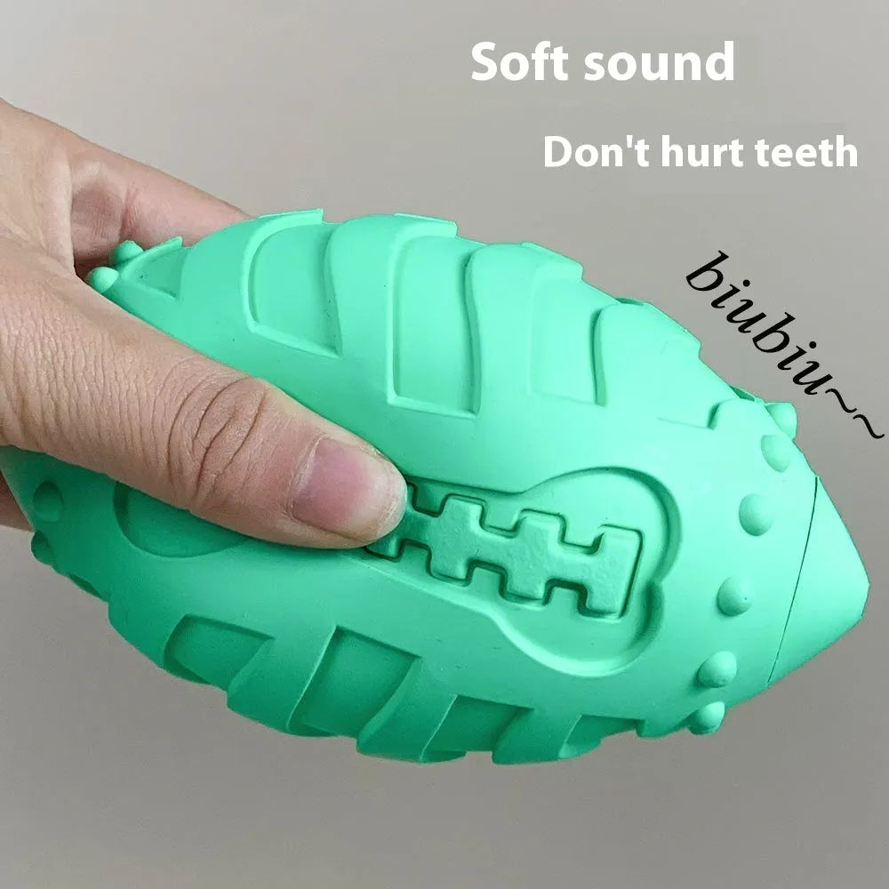 Thick rubber rugby ball dog toy in light green or sapphire blue with vocal sound feature