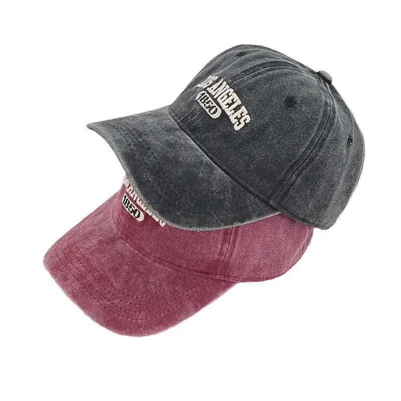 Retro personalised embroidered washed distressed peaked cap in beige with an adjustable strap.