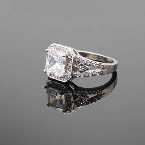 Platinum colour geometric zircon ring with hollow quadrilateral design on finger