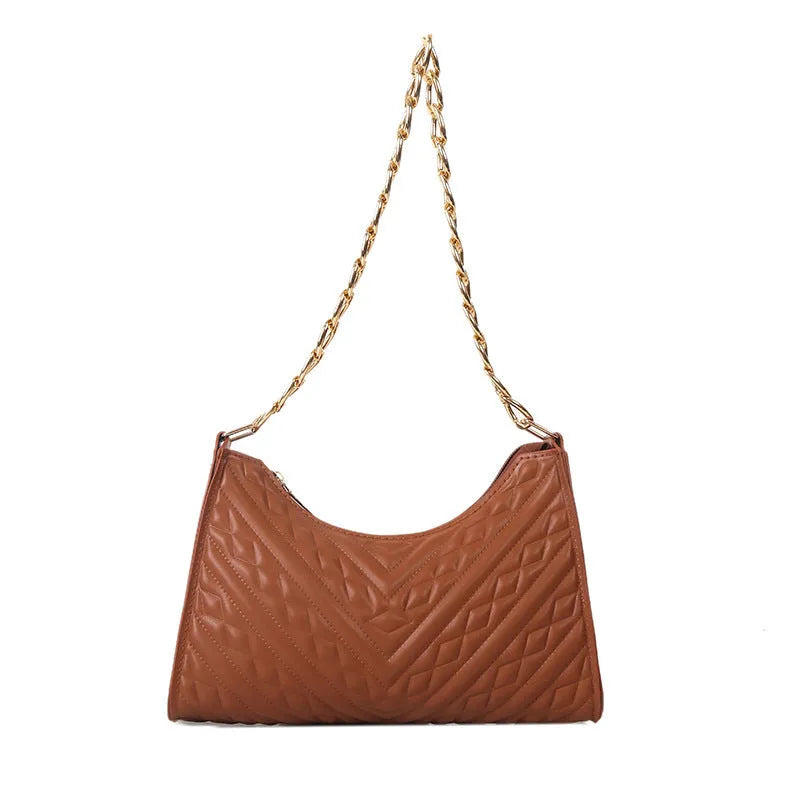 Brown pleated chain baguette women's shoulder bag with adjustable strap on a mannequin.