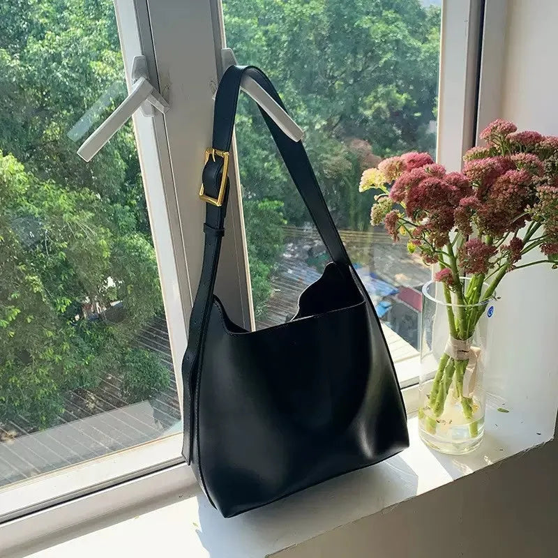 Soft black and brown PU leather ladies shoulder bags with swing thread decorative detail.
