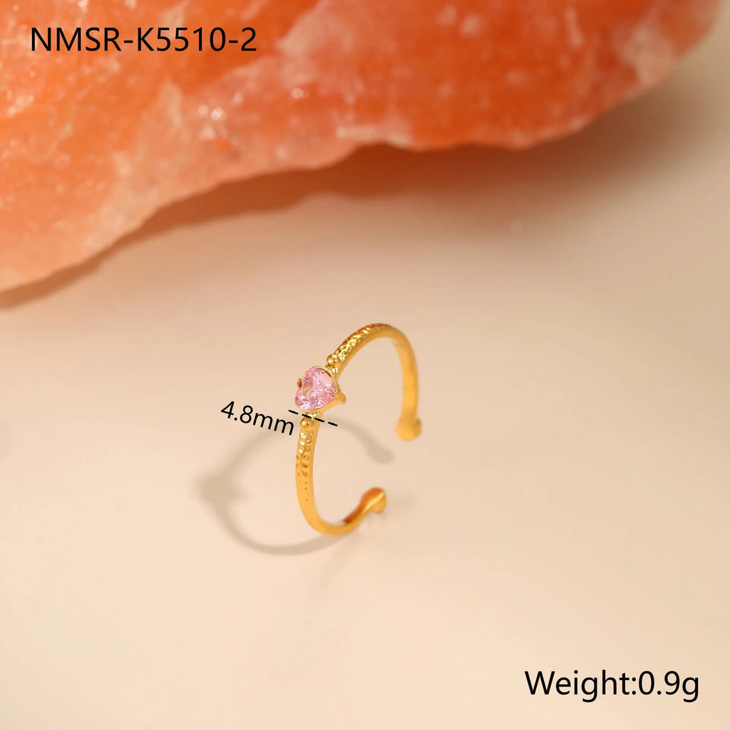 Open ended stainless steel ring with heart shaped zircon inlay in geometric design