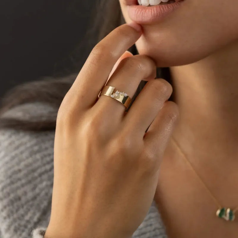 Gold electroplated zircon ring for women showing shining centre stone and metallic finish