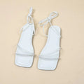Women's flat sandals with ankle bandage cloth detail and front lace-up fastening