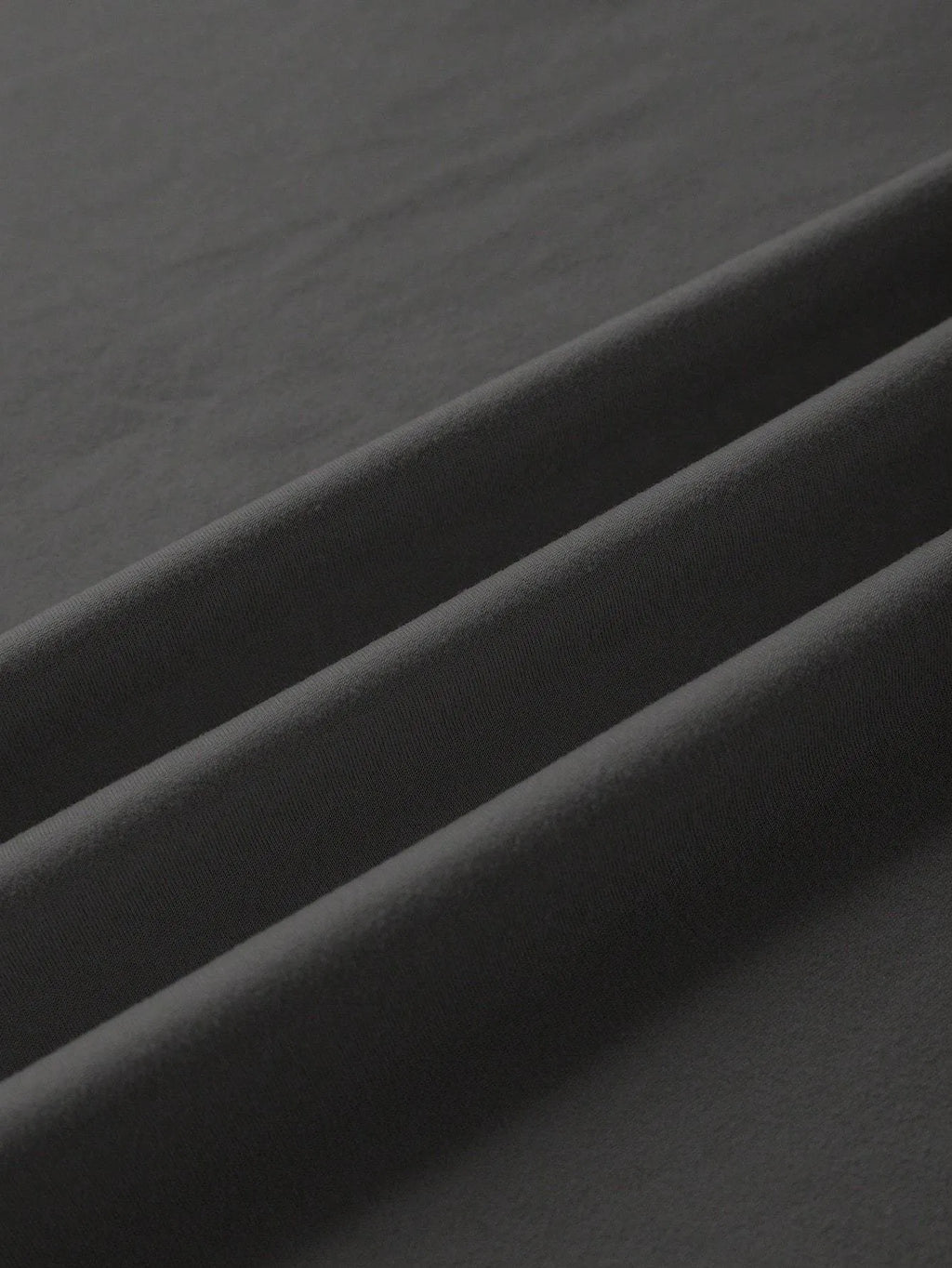 A loose-fitting cotton t-shirt with short sleeves and a round neck, shown in assorted colours.