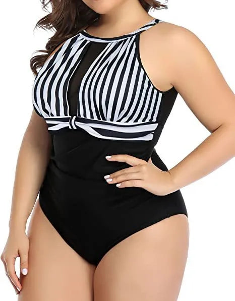 Women's black, striped, and red floral lace one-piece swimsuits on a hanger