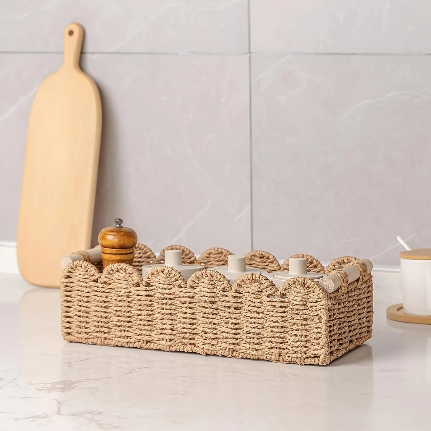 Paper woven storage basket in khaki colour on a table, dimensions 35.5 cm by 16 cm by 10 cm.