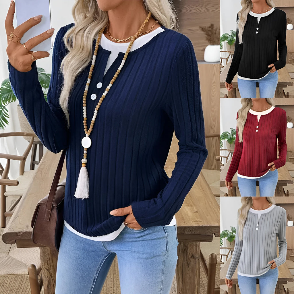 Women's black grinding stripe fake two-piece pullover sweater with round neck and button detail.