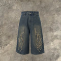 Men's black denim shorts with red flame embroidery patches on legs