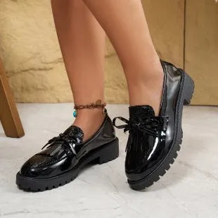 Women's black and brown bow loafers with artificial PU upper, shown in EU sizes 36-43.
