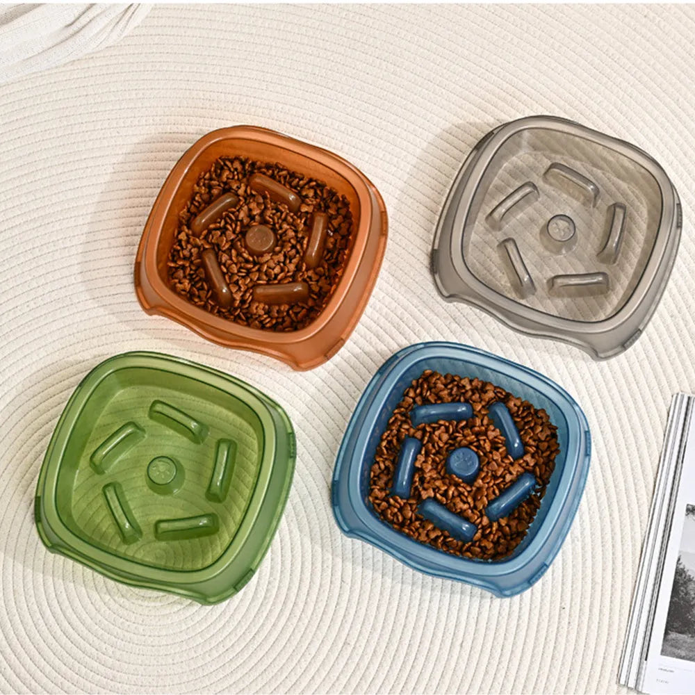 Blue plastic dog slow feeder bowl with anti-choking design on a white background.