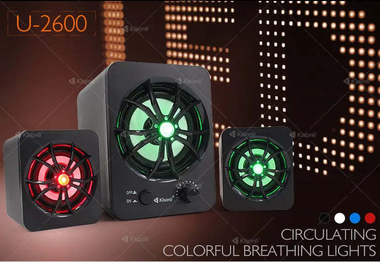Green U-2600 USB 2.1 mini computer speaker with colourful glowing lights on a desk.