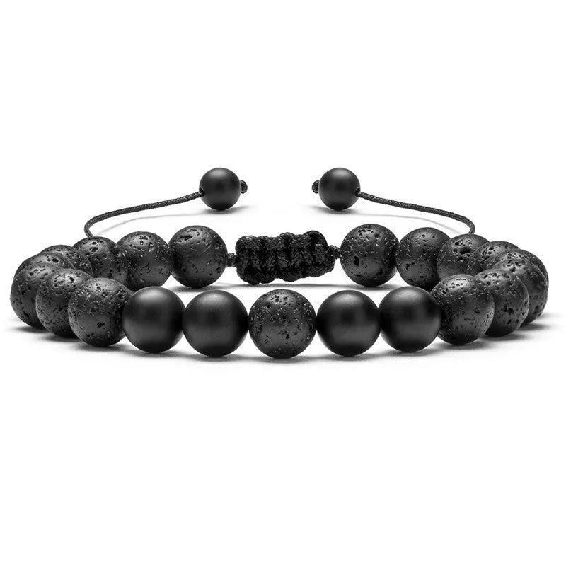 Matte black agate tiger eye bead couple bracelets with geometric design on a neutral background.