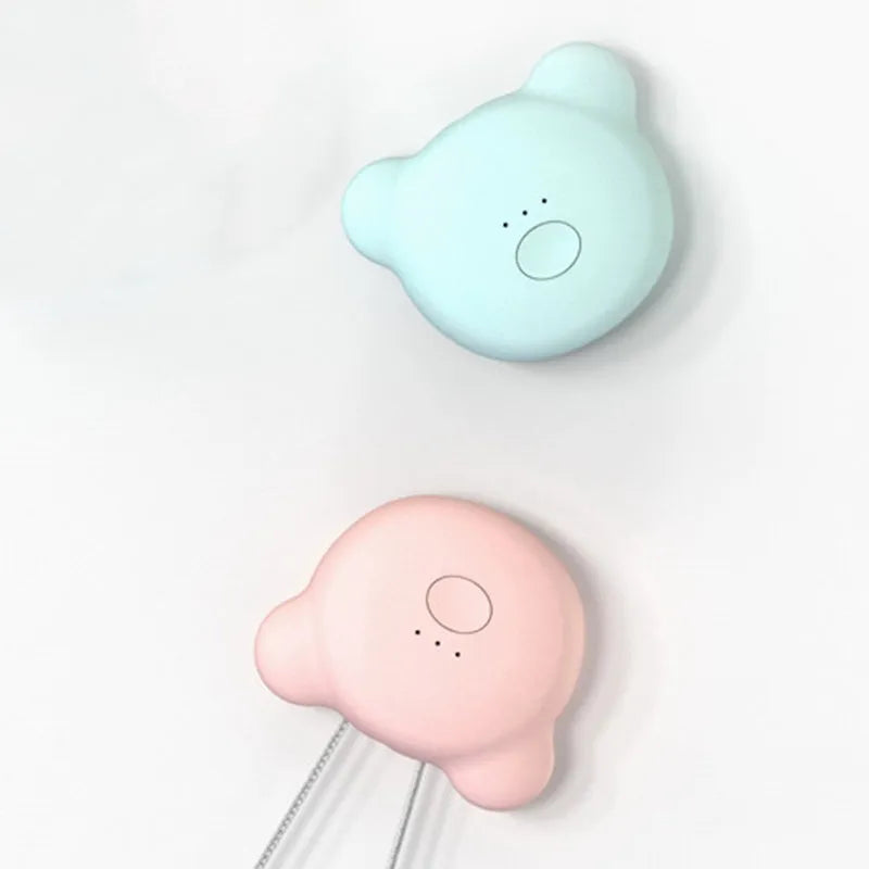 Mini USB portable air purifier necklace in blue, shown next to its charging cable.
