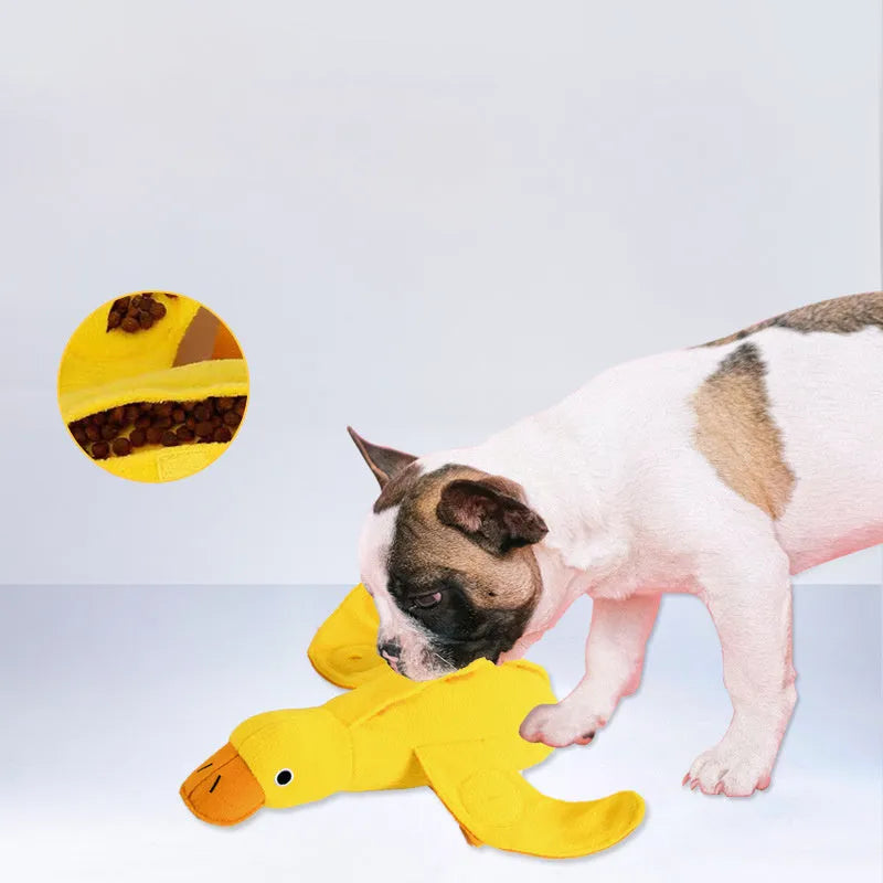 Yellow dog training toy with duck sound module and central treat dispenser slot
