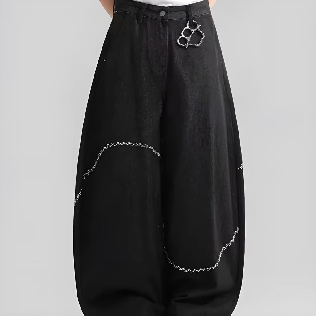 Black straight-leg denim trousers with mid-waist zip fly design on hanger