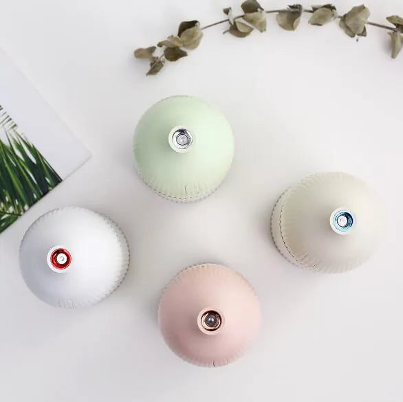 White ultrasonic aromatherapy diffuser with humidifier function and LED light, 80mm diameter
