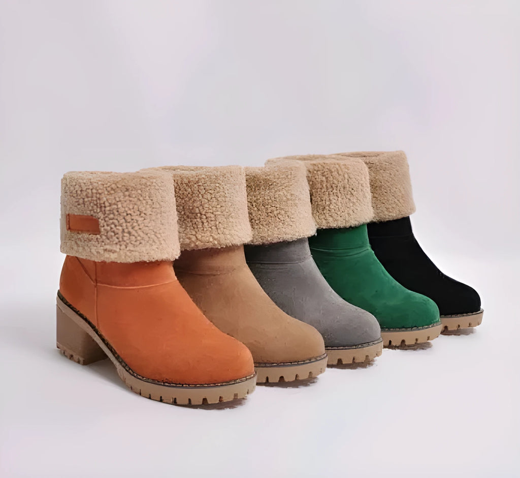 Women's mid-tube suede snow boots in black with a thick heel and waterproof platform.