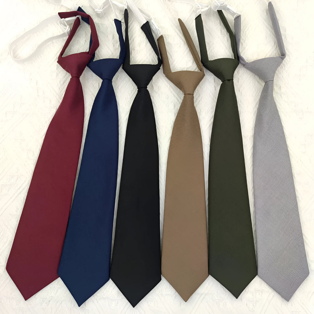 Solid navy blue cotton men's tie with arrow style on a white background.