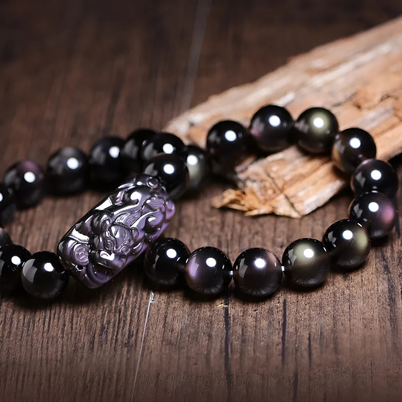 Polished crystal Pi Xiu bracelet with Ice Stone design on a wrist, showing geometric ethnic style.