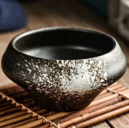 Ceramic tall Japanese soup noodle bowl in a retro glaze colour on a wooden table.