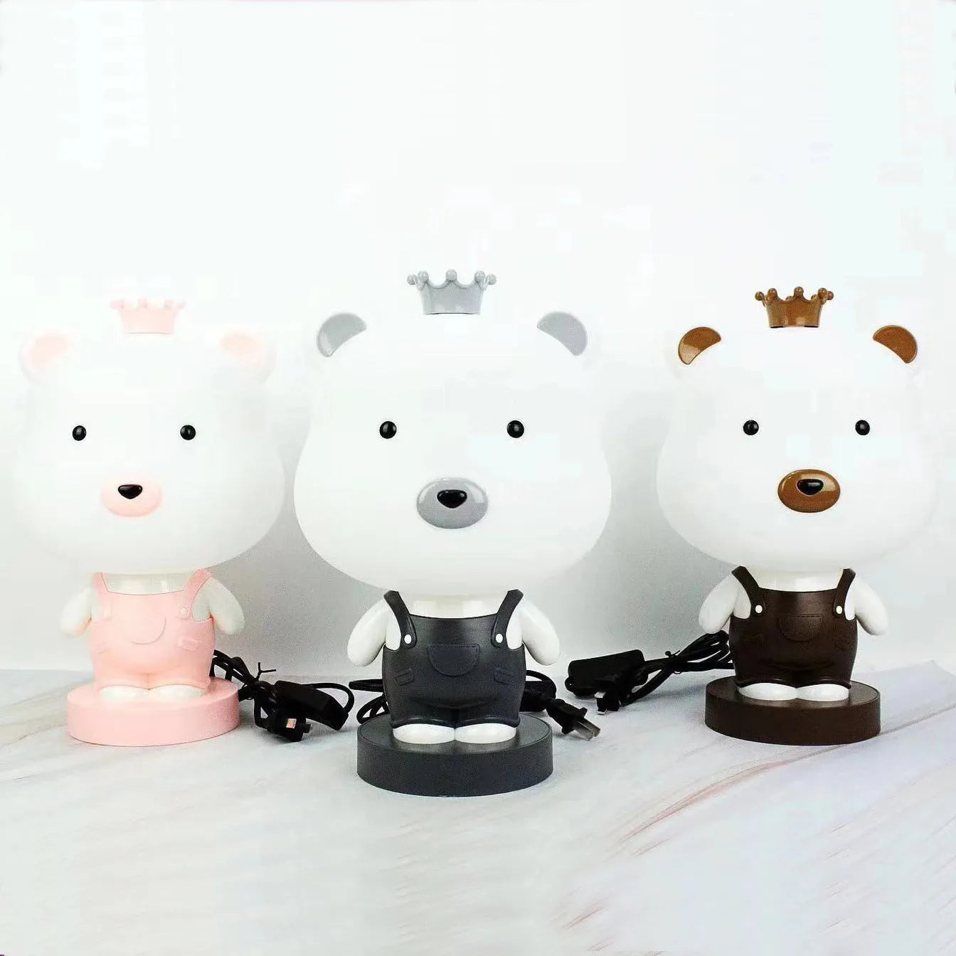 Cartoon animal table lamp in bear, cow, rabbit, or tiger design with plastic shade and LED light.