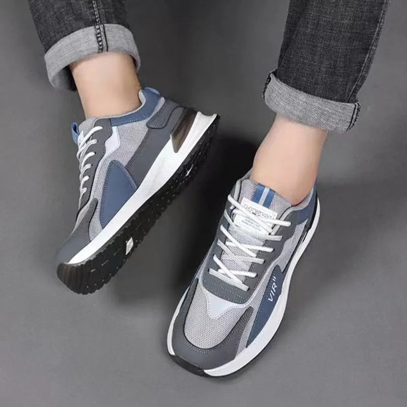 Men's low-top lace-up sneakers with colour block mesh upper and injection moulded sole.