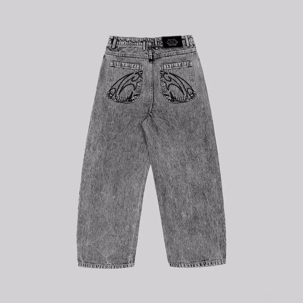 Grey loose straight-leg denim trousers for men and women on a hanger