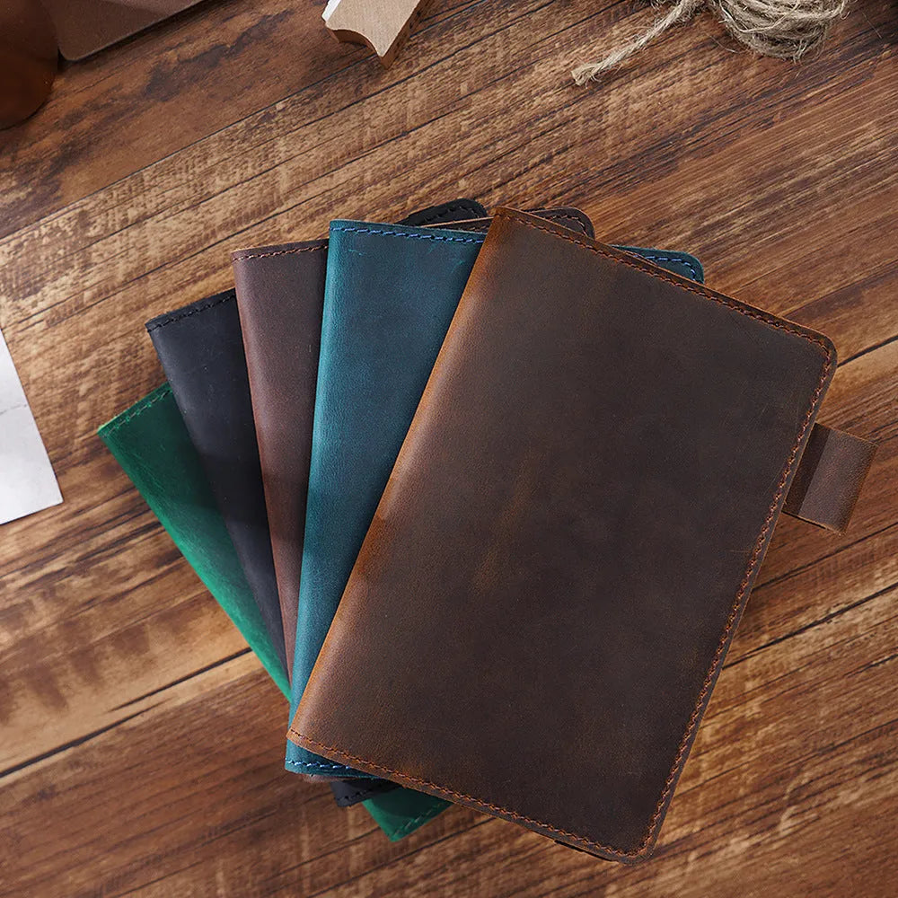 Handmade old-fashioned kraft notebook with cowhide cover, open to show 9x14cm wood-free paper