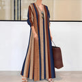 Camel coloured knitted dress with vertical stripes, V-neck and long sleeves in A-line silhouette