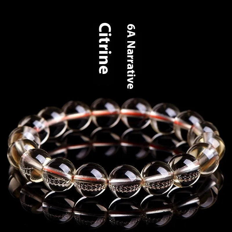 Natural citrine scattered beads ball bracelet showing polished stones in a 7A or 6A grade colour on a wrist.