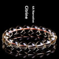 Natural citrine scattered beads ball bracelet showing polished stones in a 7A or 6A grade colour on a wrist.