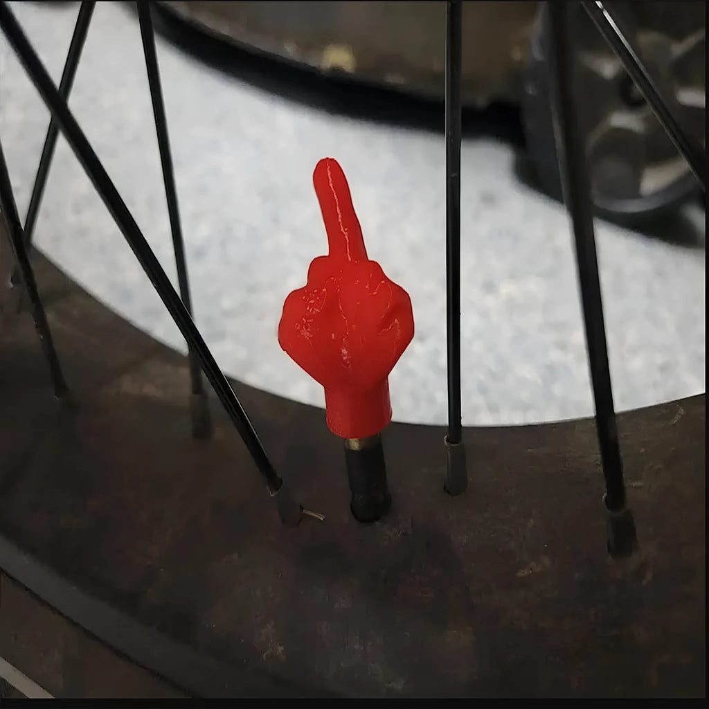 Four skin colour and four black latex car tyre valve caps for dust and moisture protection