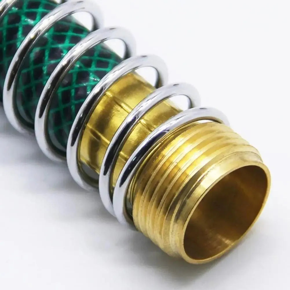 Brass garden hose connector with visible spiral spring, shown next to a measuring tape indicating 15 cm length.